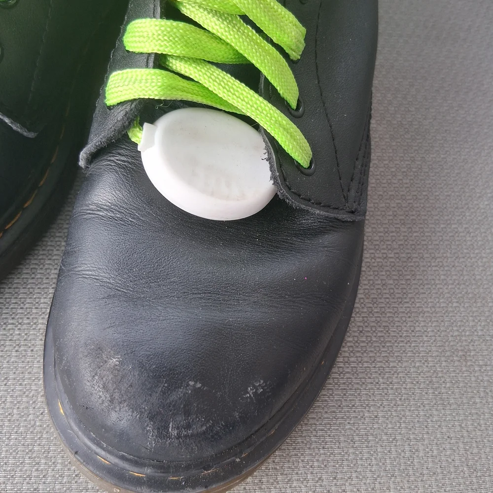 Dr. Martens Kids Black Boots with Bright Green Laces